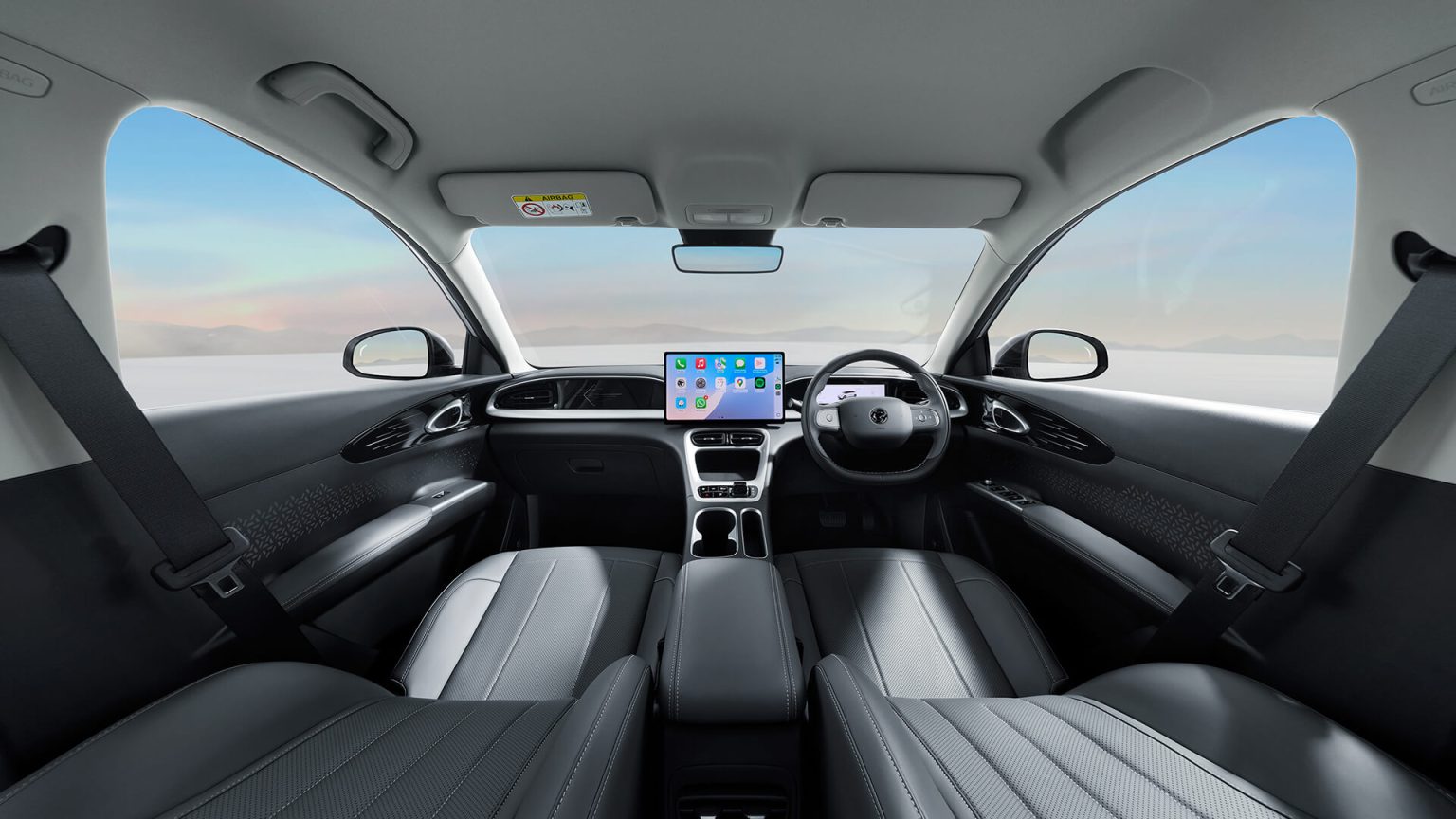 Proton e.MAS 5 Flint Grey interior showing the dual-cowl dashboard and darker leatherette seats