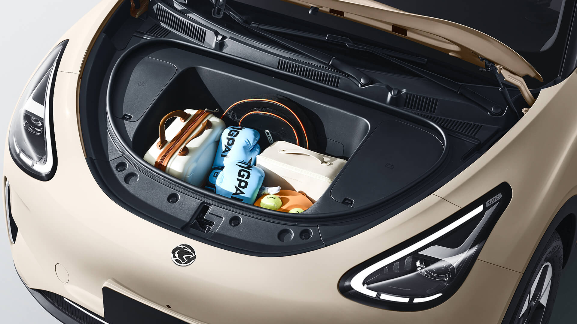 Proton e.MAS 5 boot open with luggage loaded, showing the 375-litre cargo space